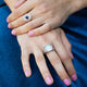 Model wearing a bold 18kt white gold cloudy aqua cabochon ring with diamond-set eagle prongs