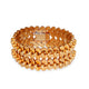 Front view of vintage 18kt yellow gold bracelet with double petal link design