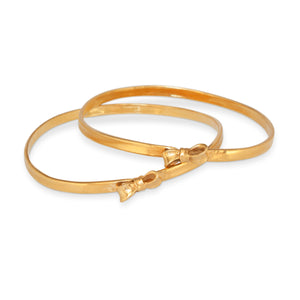Pair of Angela Cummings Bow Bangles from 1984
