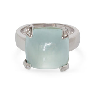Ring with a Aqua gemstone and white gold and diamond accents on a white background