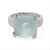 Ring with a Aqua gemstone and white gold and diamond accents on a white background