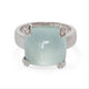 Ring with a Aqua gemstone and white gold and diamond accents on a white background