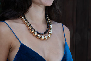 Gump's 18-inch onyx bead necklace with 14kt gold accents, classic design that can be layered!