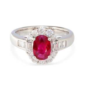 Front view of platinum ring with vivid red Burmese ruby and split halo of diamonds