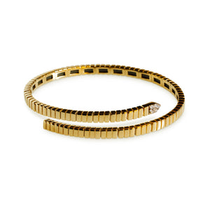 14kt yellow gold flexible diamond bypass bangle bracelet on white background
