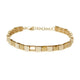 Close-up view of 14kt yellow gold bracelet with alternating polished and diamond pave square links.
