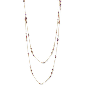 Full view of 18kt yellow gold pink sapphire diamond-by-the-yard necklace laid flat