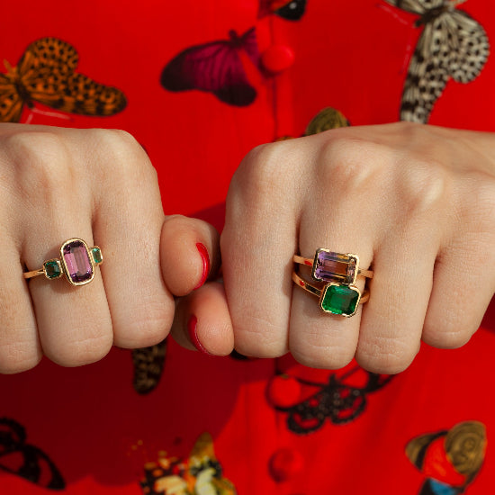 14kt yellow gold ring featuring a 3.90ct emerald-cut ametrine in a semi-bezel setting with red background