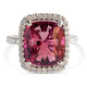 Close-up of fantasy-cut pink tourmaline ring with diamond halo set in platinum.