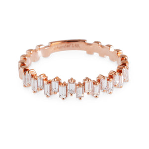Close-up of 14kt rose gold staggered baguette diamond eternity band ring